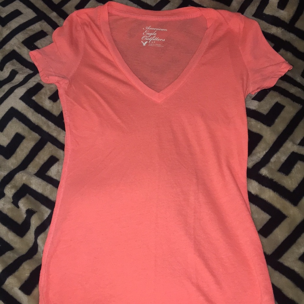 Bright orange v neck shirt